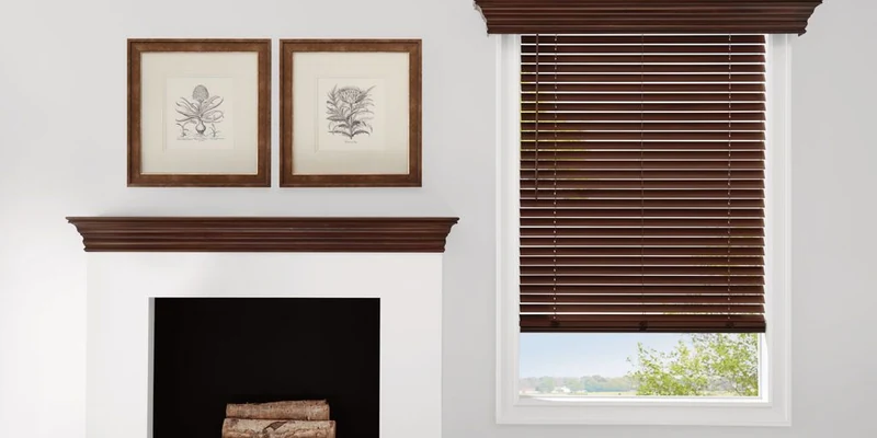 Hunter Douglas Parkland wood blinds in Mission Oak partially lowered beside a white fireplace with matching dark wood trim.